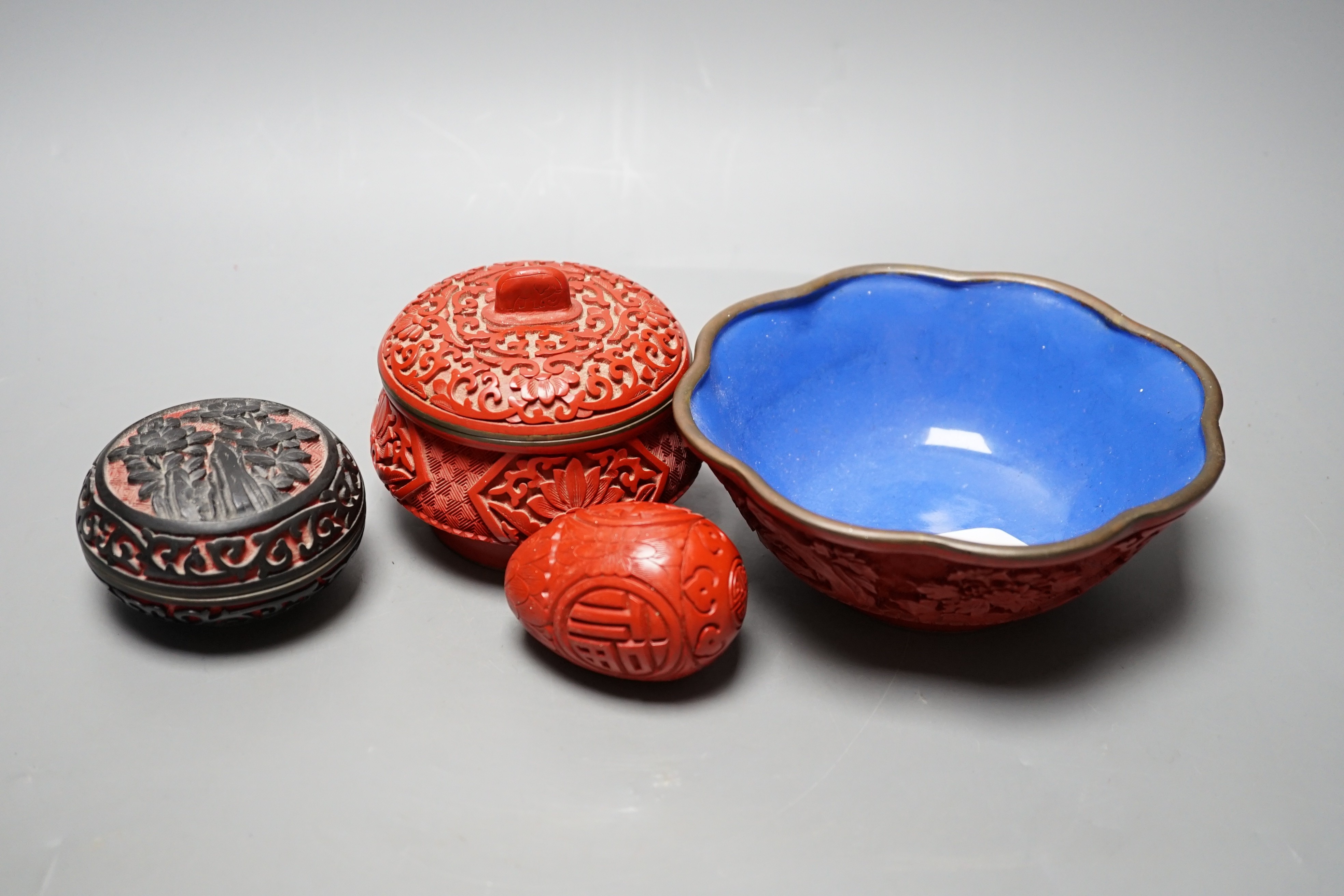 A Chinese cinnabar lacquer bowl, 15cm a similar covered box and egg, and a carved circular box and cover